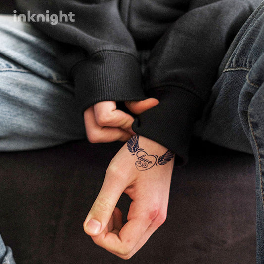 Winged heart love temporary tattoo on hand – waterproof herbal ink body art